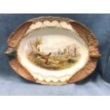 A large oval Royal Worcester ashet embossed with pheasant handles and wings, the panel decorated