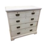 An Edwardian painted chest of drawers, with rectangular moulded top above two short and three long