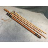 A Victorian militia batton with original painted decoration and numbered 57; two swagger sticks -