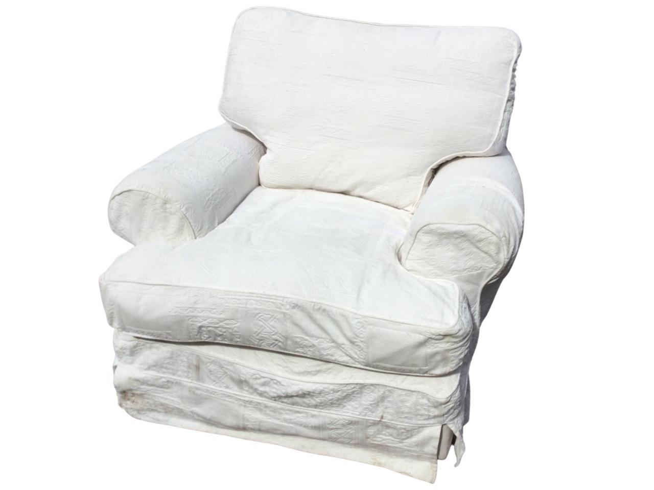 A large contemporary armchair with padded back and loose cushions, having wide bolster arms and