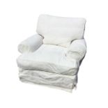 A large contemporary armchair with padded back and loose cushions, having wide bolster arms and