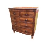 A nineteenth century bowfronted mahogany chest of drawers with two short and three long knobbed