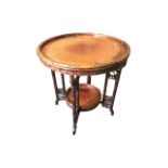 A circular eastern tray top table with burr walnut central panel framed leaf carved rim above a