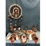 Various native American themed wall hangings modelled as heads with traditional facepaint and