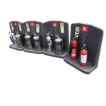 Four fire extinguisher portable display stands with eight miscellaneous fire extinguishers. (12)