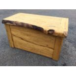 A craftsman made beech coffer with thick naturalistic plank hinged lid above dowel jointed