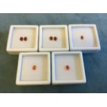 A collection of boxed opals - two pairs of oval fire opals - approx 0.5 carats per pair; a single