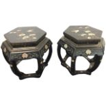 A pair of Japanese hexagonal lacquered occasional tables, the tops decorated with birds and