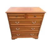 A contemporary Stag chest of drawers, with two short and three long panelled drawers, raised on