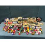 A collection of 32 vintage boxed vans - Ledo, diecast, Days Gone, etc; and a collection of play-worn