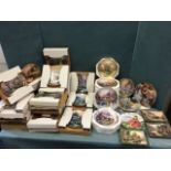 Boxed collectors plates by Thomas Kinkade from the Lamplight Village and Enchanted Cottages