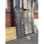 A quantity of old shutters, cupboard doors, pairs, some panelled, etc. (A lot)