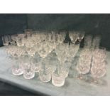 A quantity of drinking glasses - Edinburgh cut crystal, tumblers, wine glasses, brandy balloons,