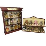 A collection of nine Steiff ceramic bears on a The Beautiful Bears of Steiff stand, the