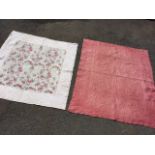 A floral cotton quilt having central panel of roses and foliage with pale pink border; and a pink