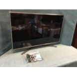 An LG 42in flatscreen TV, complete with remote, power cable, manual, etc.
