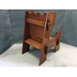 A late Victorian oak arts & crafts childs chair of pegged construction, having shaped sides and