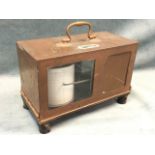 A copper cased barograph by F Darton & Co Ltd, the rectangular case surmounted by a swan-neck