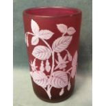 A tubular Thomas Webb & Sons style cranberry glass vase, cut and etched from the white with fuschias