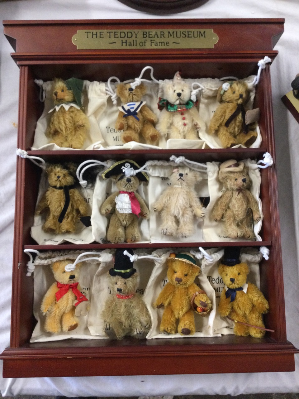 A collection of nine Steiff ceramic bears on a The Beautiful Bears of Steiff stand, the - Image 3 of 3