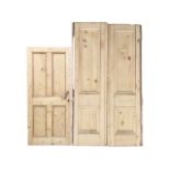 A pair of tall striped pine doors, each with two moulded panels, having been hung both ways - 26.5in