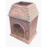 A cast iron garden brazier with brick style panels enclosing the burning chamber with grill