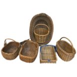 An oval cane washing basket with twin handles; and five miscellaneous cane shopping baskets with