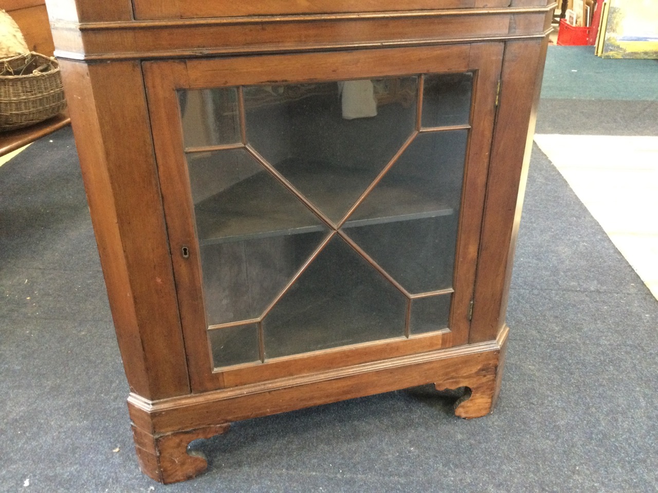 A large nineteenth century mahogany corner cupboard with moulded cornice above two astragal glazed - Image 2 of 3