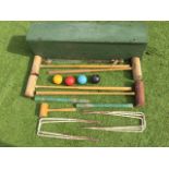 A boxed croquet set with mallets, balls, hoops, pegs, etc. (A lot)