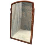 An antique mirror with bevelled plate in cushion moulded shaped frame, with oak backing. (16.5in x