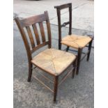 A nineteenth century oak church-type chair with platform back rail on chamfered columns above a rush