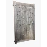 A large pine stable door with tongue & grooved panel to rectangular frame, the back with Z-