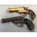 An Edwardian brass Webley & Scott 1in flare pistol with mahogany handle; and another similar in
