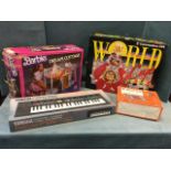 A boxed Barbie dream cottage; a Yamaha electronic keyboard PSS-170 - boxed,; a Commodore 64 -