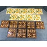 A collection of eight Victorian encaustic terracotta floor tiles; and a set of nine tube-lined