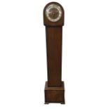 A walnut cased grandmother clock with arched hood above a silvered chapter ring and Enfield chime