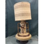 A large 60s style studio pottery terracotta tablelamp, the vase with bun shaped base beneath a