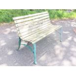 A rectangular garden bench with curved slatted back and seat on cast iron shaped supports. (48in)