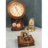 A model Watts steam engine; an anniversary clock under glass dome; and a wallclock by Acctim of