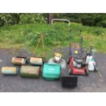 Two vintage Qualcast manual push mowers, and additional grass boxes; a petrol Flymo; a Honda