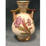 A Royal Worcester blush ivory vase with pierced handles and rim painted with purple, pink and orange