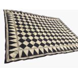 A felt masonic carpet from a Scottish lodge with central chequered field framed by diamond border,