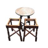 A glass topped oak table on stained legs with cross stretchers; and a pair of table bases on