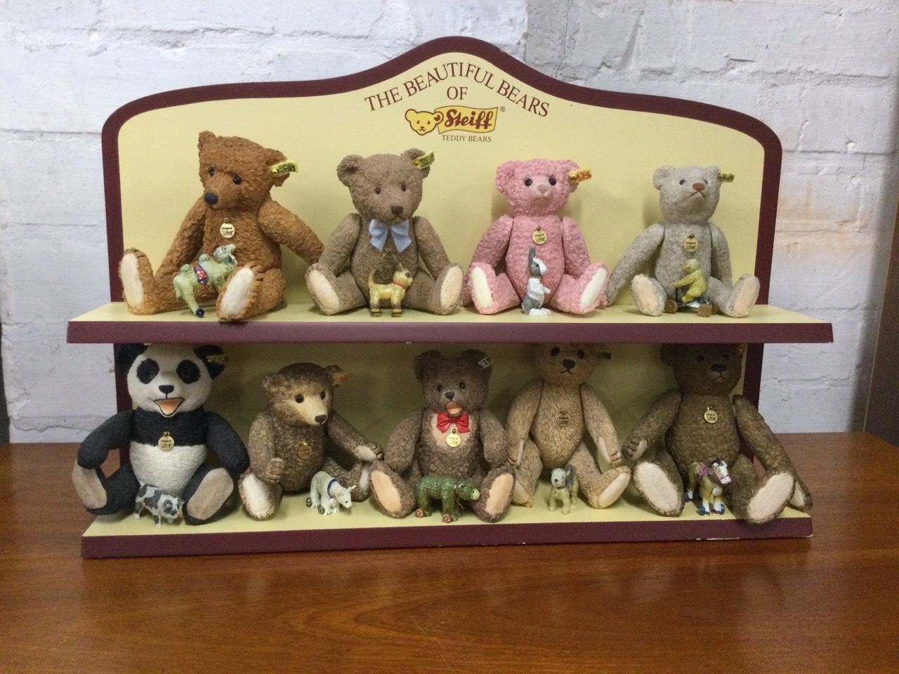 A collection of nine Steiff ceramic bears on a The Beautiful Bears of Steiff stand, the - Image 2 of 3