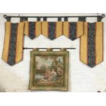 A Brussels style tapestry panel depicting lovers by riverside in landscape, framed by leaf