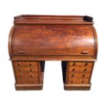 A Victorian mahogany cylinder bureau, with moulded gallery rail to top above a fitted interior