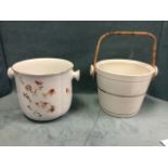 A Doulton Burslem slop pail decorated with flowers; and another with gilt bands having cane swing