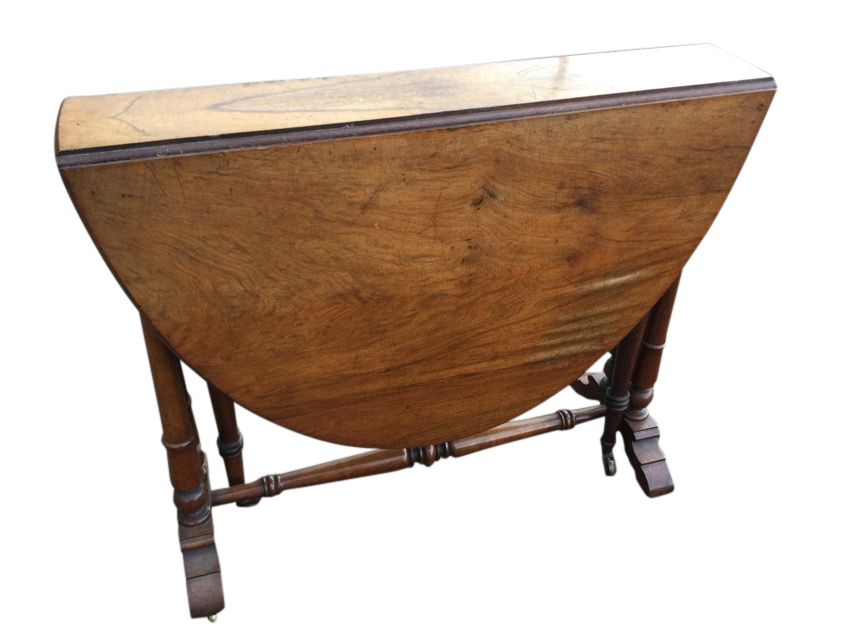 A Victorian walnut sutherland table with two rounded drop leaves forming an oval moulded top,