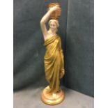A large Royal Worcester water carrier figurine, the classically draped lady holding a pitcher to