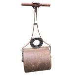 A Waring & Gillow Ltd cast iron Victorian garden roller, the twin drum with shaped handle and T-bar,